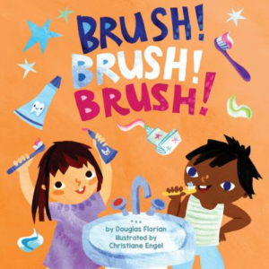 Photo of an orange book cover featuring an illustration of two girls brushing their teeth. Text above them reads "Brush! Brush! Brush!" surrounded by tubes of toothpaste and a toothbrush.