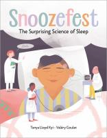 Photo of a book cover with a large cartoonish graphic of a man asleep in his bed, surrounded by three tiny scientists in white lab coats. A thought bubble above them reads "Snoozefest The Surprising Science of Sleep."