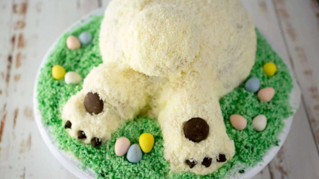 Photo of a frosted Easter cake shaped like a white Easter bunny's backside