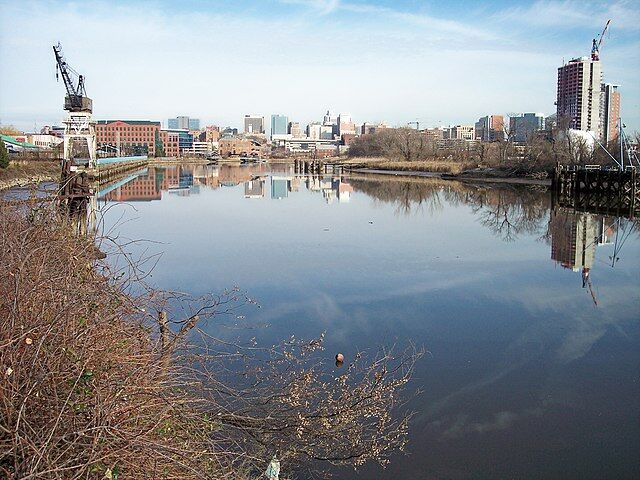 Photo of a river bordering a small town.