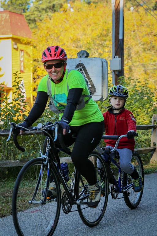 A mother and son riding bikes
