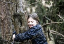 Make Friends with Trees A girl hugging a tree