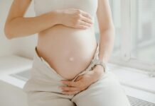 Close-up on a woman's pregnant belly