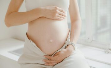 Close-up on a woman's pregnant belly