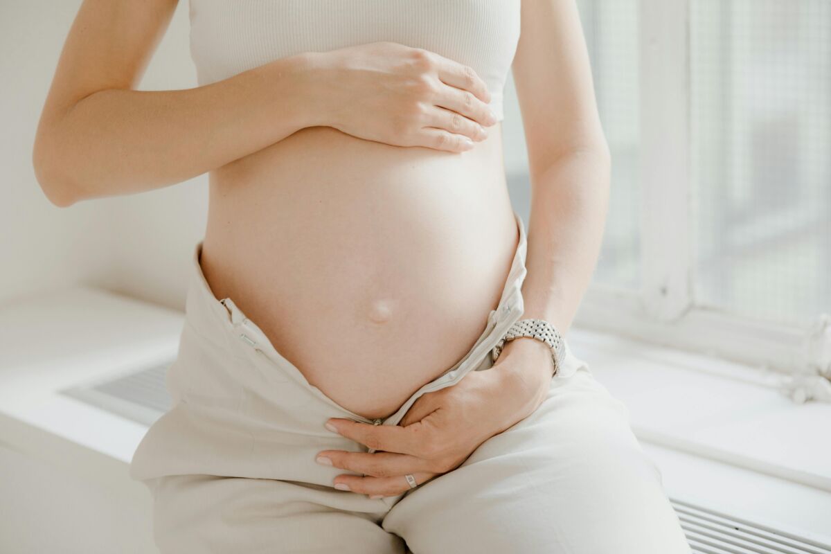 Close-up on a woman's pregnant belly