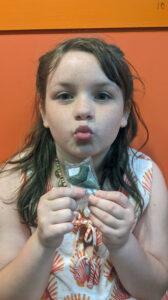 Stephen Godfrey's daughter, Zoey, with a megalodon tooth found at Calvert Cliffs