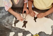 Kids cut out bunny shapes in dough as they bake in the kitchen