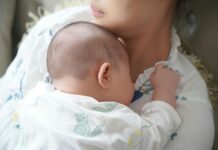 Fresh Start to Motherhood Mother holding a baby