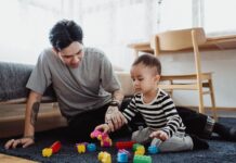 Father and baby playing with blocks