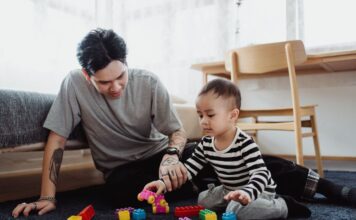 Father and baby playing with blocks