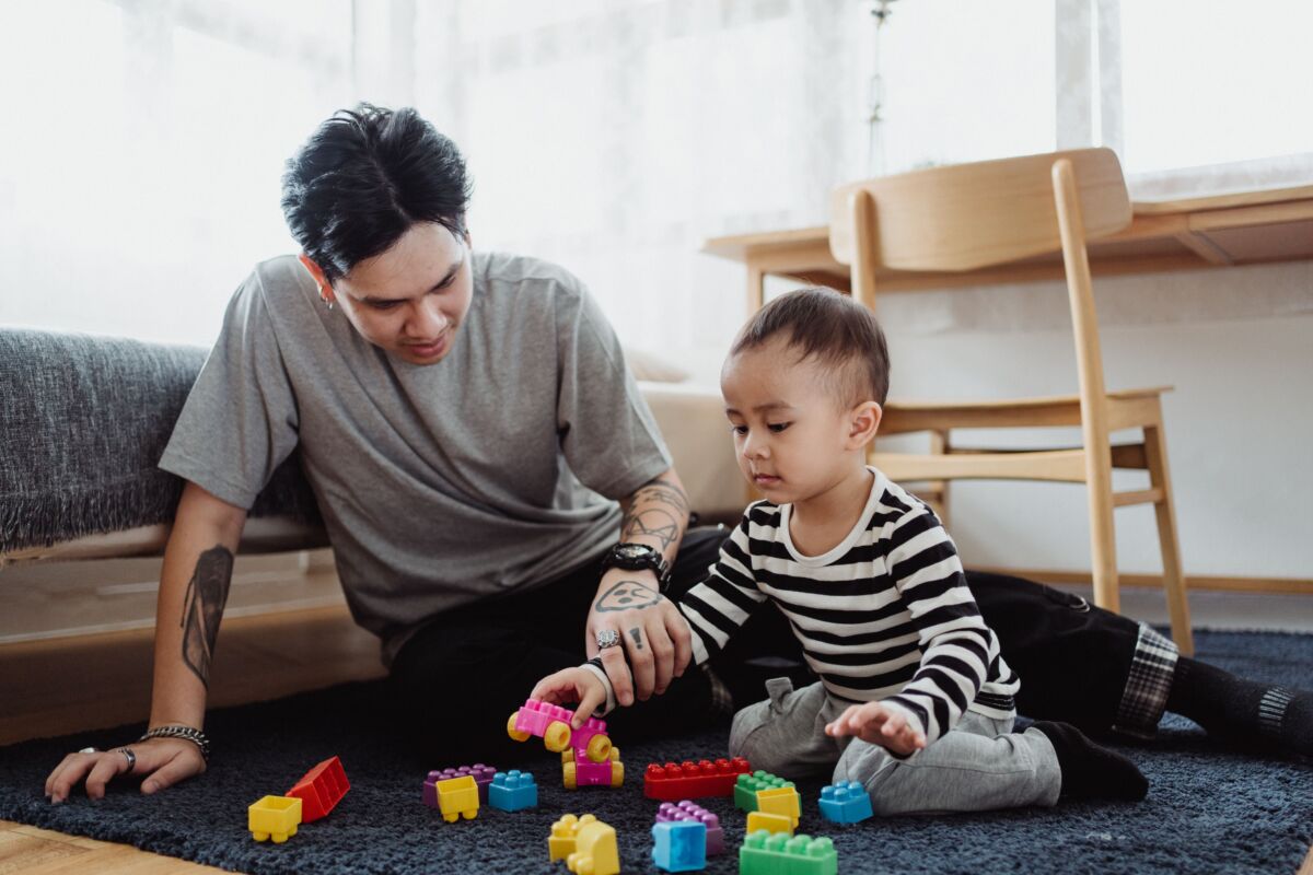 Father and baby playing with blocks