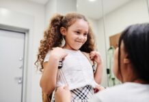 A girl gets ready to go to school