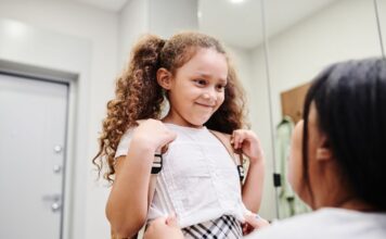 A girl gets ready to go to school