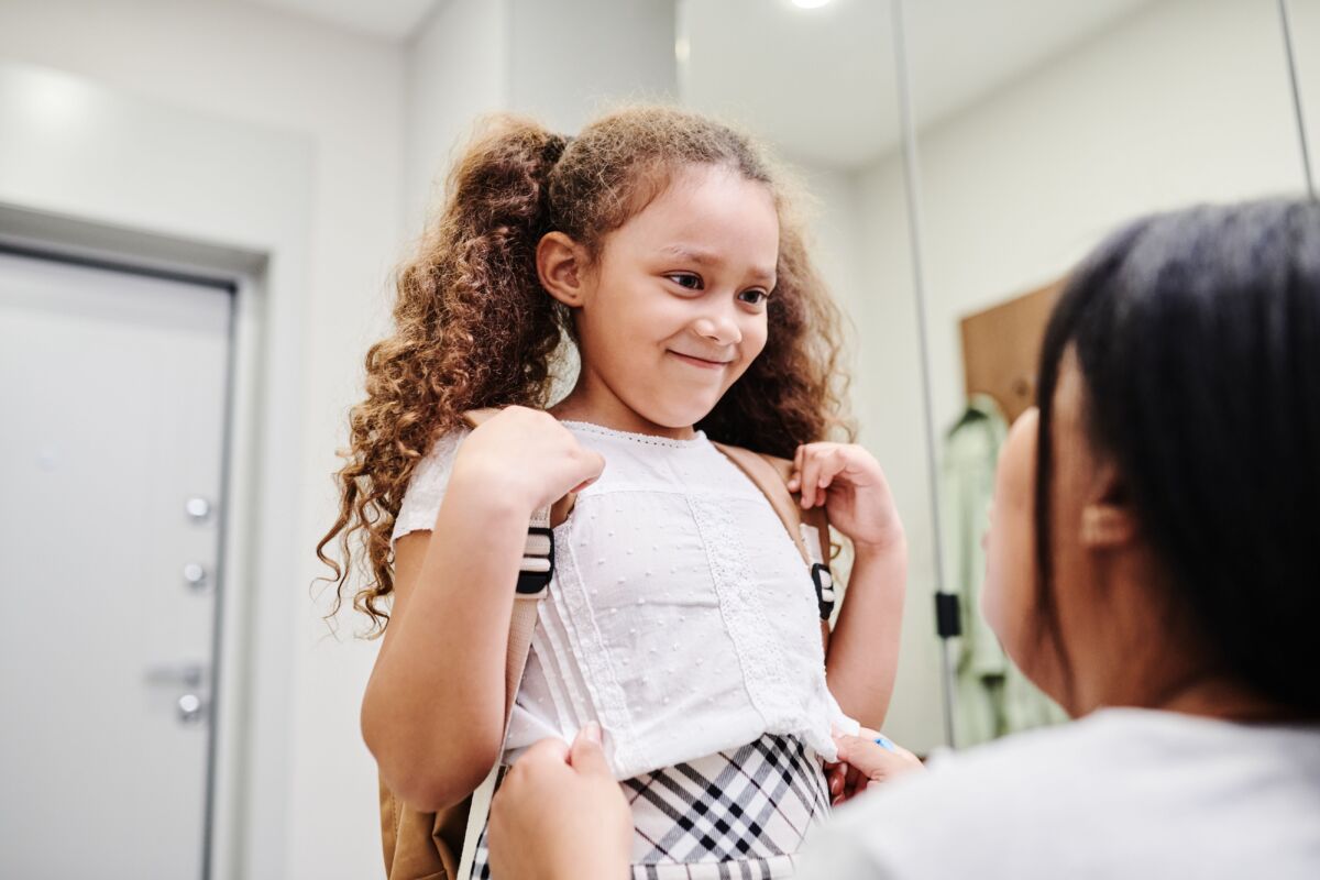 A girl gets ready to go to school