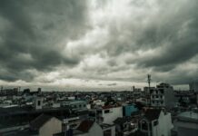 Storm clouds above a city skyline