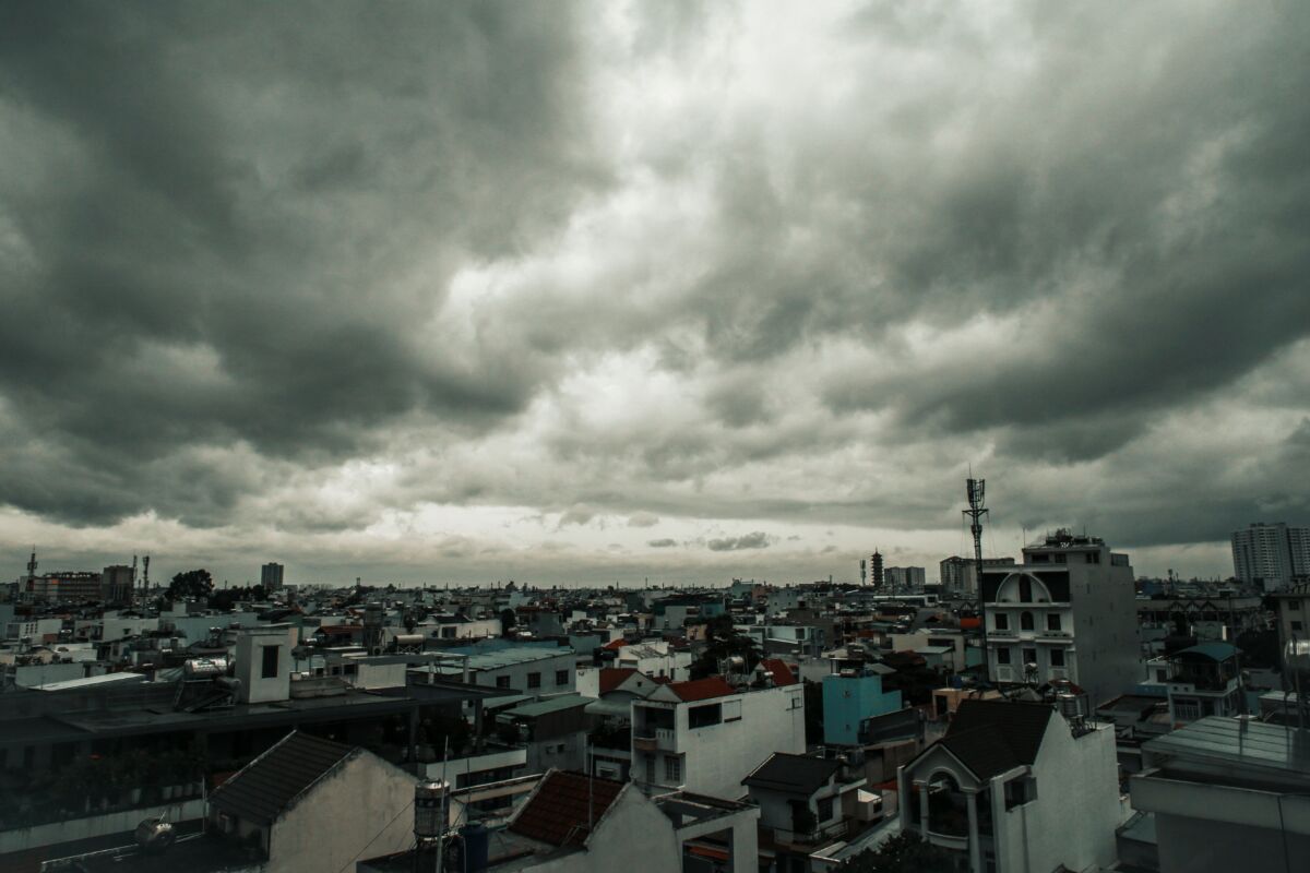 Storm clouds above a city skyline